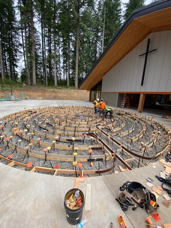 Curved concrete slab formwork and rebar for a church
