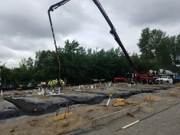 Pumper truck placing concrete on a complex reinforced foundation